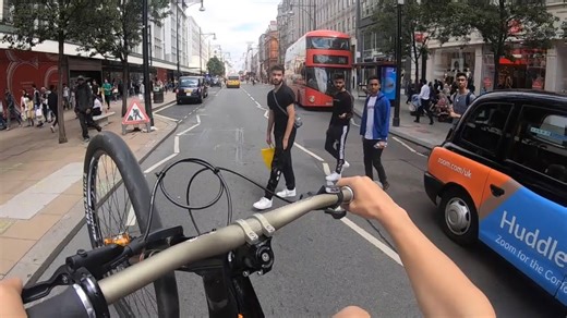 Cyclist attempts one wheel challenge through city