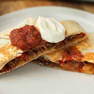 These taco-dilla wraps have it all: freshly cooked veggies, flavorful Kroger Brand barbacoa, and melty cheese. They’re the perfect summer bite! | Tasty