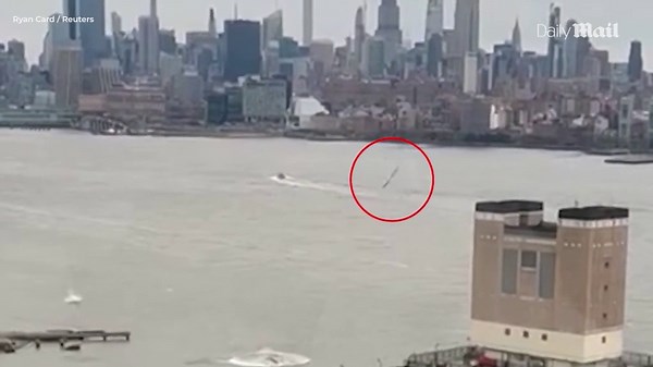 Moment helicopter rotor flies off and splashes into NY's Hudson River