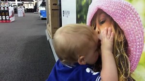 Kid lands the cutest first kiss ever