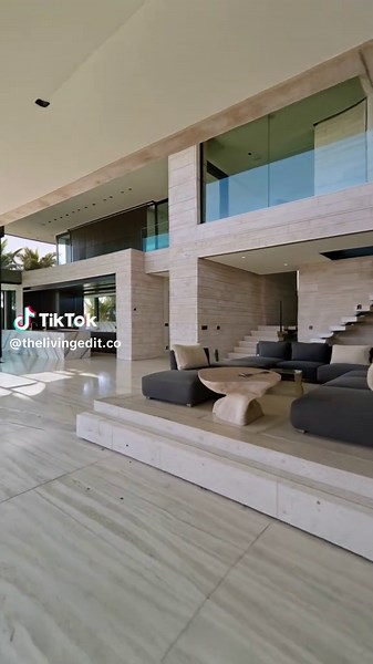 Looks minimal at first… Then the camera moves deeper inside. Stone floors, a sculpted marble kitchen, glass walls opening to palm trees and an infinity pool. Interior or the view outside? #LosAngeles #LuxuryHomes #MalibuRealEstate #architect #interior