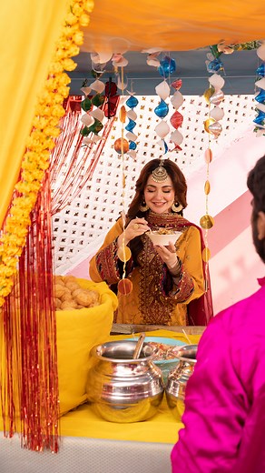 Baje Dhol Taashe Collection by Asim Jofa | Launching on 23rd December at 6 PM AJDA-25 | 3-PC | Unstitched | Rs. 6,350/- Revel in the Mustard Radiance of Festival Harmony with this ensemble from the "Baje Dhol Taashe" collection. The mustard gold number featuring a maroon grand luxe neckline and borders capture the vibrant spirit of a meal. The shirt's antique gold zariwork and gold-cupped sequins paired with maroon and navy blue threadwork create a vivacious design. The double-contrast border on