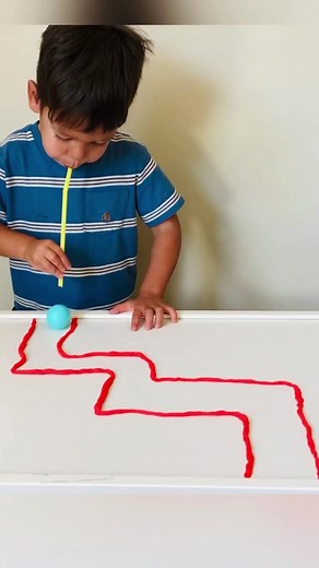 Ping Pong Playdough Straw Maze 💡 ages 2 💡 Here’s a great activity for building those oral motor skills. All you need is some playdough, straws and a ping pong ball. Start by rolling out long lines of playdough (great fine motor practice for kids able to do this). Then shape the lines into a maze. We chose to keep the lines very thin which made it more challenging to keep the ball in the maze. Finally, place a ping pong ball at the start of the maze and have kids use a straw to blow the ping po
