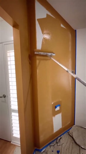 the process of painting walls using a roller brush #shortvideo