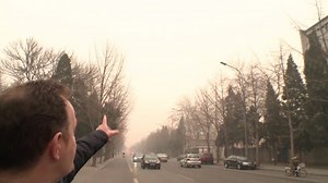 China pollution: Beijing smog masks tallest building