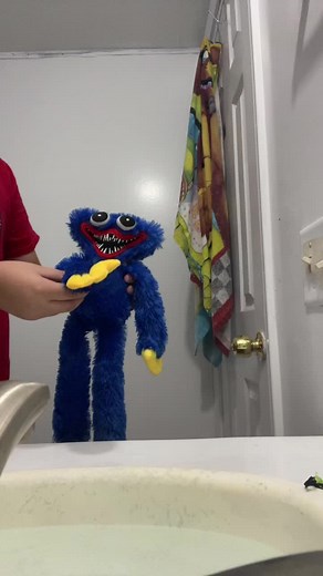 Interactive Blue Puppet Play in a Colorful Bathroom
