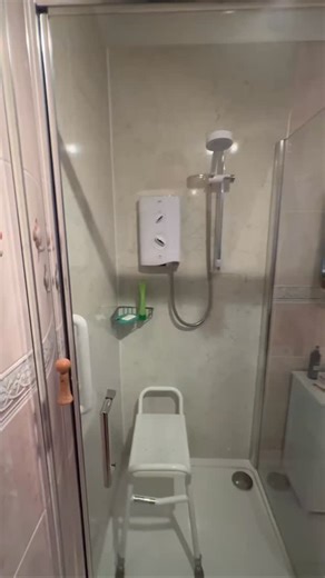 🚨Festive period emergency adaptations🚨 This bathroom has been fully adapted into a level-access wet room designed to provide safe, accessible, and independent use. The shower area is fully open plan with a flush, slip-resistant tiled floor and a centrally positioned linear drain to ensure effective water run-off and reduce trip hazards. There is no shower tray or step, allowing unobstructed access. The wet room is fitted with underfloor heating, which provides consistent, evenly distributed wa