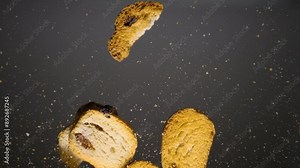 Flying crackers in slow motion, dry bread slowly falling with crumbs