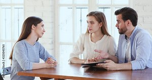 Angry disappointed couple clients claim insurance payment meeting manager
