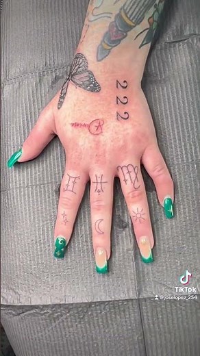 Butterfly Hand Tattoo | Fine Line Finger Designs & Red Ink “Divine” Lettering