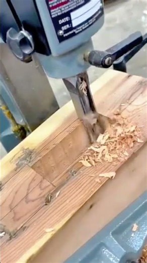 Cutting drilling and shaping wooden block using machine to create clean precise rectangular slot