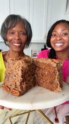 This German Chocolate Cake is rich, tender, and layered with sweet coconut pecan frosting. 🍫🥥Type RECIPE and I'll drop it in your DMs. | Grandbaby Cakes by Jocelyn Delk Adams