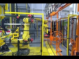 Automotive Cockpit Assembly Line with Robot unload - IntelliTrak 500 Series Overhead Conveyor