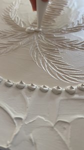 What medium did I use? Great question!! The base of this design was a palm tree made with texture paste. For this one, I used a mix of joint compound, modelling paste, and acrylic paint. I couldn’t give exact measurements because it really depended on the climate and the specific products I was working with. Once the painting was dry and sealed with interior house paint, I went in with some light modelling paste in a piping bag and piped little decorative balls on top. I had to use different med