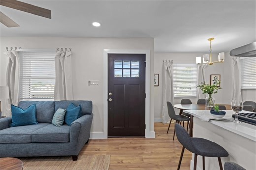 LOCATION LOCATION LOCATION!! This recently renovated home offers modern comfort and style. The interior features new flooring and fresh paint, creating a clean and inviting atmosphere. A new AC system ensures year-round comfort, and the newly remodeled bathroom adds a touch of luxury. The kitchen boasts new appliances, making cooking a delight. Step outside onto the brand-new deck, perfect for outdoor relaxation and entertainment. The large lot allows plenty of space for get togethers or busines