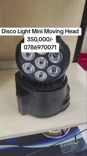 The item shown is a mini LED moving head light used for stage and disco lighting. Type: It is a moving head light, designed to pan and tilt for dynamic lighting effects. Technology: It uses LED technology for powerful and vivid color output. Features: The fixture has multiple individual LED lenses, often capable of RGBW (Red, Green, Blue, White) color mixing. Application: These are commonly used by DJs, in theaters, and for various events due to their compact size and versatility. Control: They 