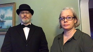 Justin and Rachel wanted to express their gratitude for thousands of comforting comments and for generous donations. #ClarisaVollmar & #LilPearl. Image description: Justin with black bowler hat, eyeglasses, black suit with white dress shirt, and black bowtie. Rachel with gray hair, eyeglasses, and dark green shirt. The background is light green paint with a painting of lake. Video transcript: Justin - Hello our beloved community. We wanted to thank you for your support, thoughts, & prayers. They