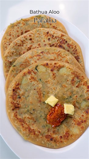 Viraj Naik on Instagram: "Bathua Aloo Paratha Recipe Bathua Aloo Paratha is a wholesome and delicious winter special, made with the goodness of fresh bathua leaves and spiced mashed potatoes, this stuffed paratha is a comforting meal perfect for breakfast, lunch, or dinner. Serve it hot with curd, pickle, or a dollop of butter for an irresistible flavor. Simple to make and full of nutrients, it’s a must-try recipe this season. #BathuaAlooParatha #WinterSpecial #IndianBreakfast #StuffedParatha #G