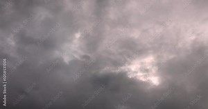 This is a time-lapse video of moving clouds and a dark sky before rain. It shows a beautiful landscape with a cloudy sky. This image was taken in Myanmar with a 4K high-resolution camera.