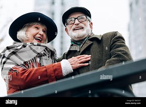 Pleased senior woman embracing her happy husband Stock Photo - Alamy