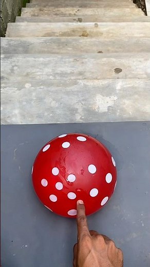 Experiment: Dropping a polka-dot water balloon from the top of the stairs—will it burst?