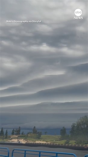 Drone footage captured the stunning sight of massive shelf clouds stretching far across Lake Michigan. https://abcnews.visitlink.me/r2bTD9 | ABC News