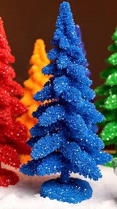 Create enchanting crystal trees using rainbow baking powder! With a simple blend of ingredients, you'll witness a colorful transformation as the crystals grow beautifully in vibrant hues. #CrystalTrees #RainbowBaking #FunWithScience | Charming Recipes
