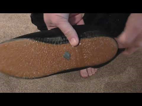 Changing into vintage 1960s black plimsolls ( canvas sneakers ) Woolworths