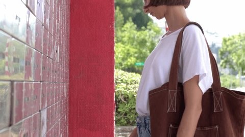 clip-4012436337-close-up-young-woman-opening-checking-mailbox-on