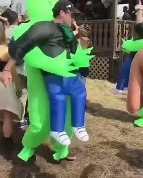 Green Alien Carrying Human Costume