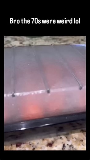 trend_tok_hub on Instagram: "The post showcases a 1970s Presto Hotdogger, an electric appliance that cooks hot dogs by passing current through metal prongs, demonstrating its quirky operation in a 23-second video that amassed 3.4 million views and 17,000 likes. User reactions evoke nostalgia for 1970s childhoods, with replies joking about the device's "electrocution" style and sharing anecdotes like metallic-tasting results or parental indifference to sparks. The gadget exemplifies era-specific