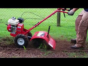 Rotary Hoe 50cm rotavating grass into a garden bed