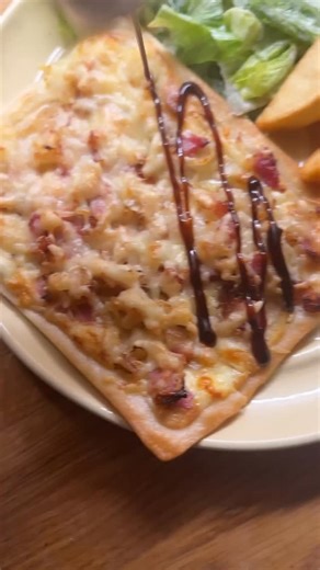 Humpday Meal! Tarte flambé or Flammekueche And we’re back and I’ve forgotten how to do all of it. But the result was very pleasing. Simple and pretty quick too. This is based on a recipe I found on @marksandspencerfood website. Ingredients - 250g plain flour - 50ml olive oil - pinch salt - 125ml water - 2 small brown onions or 1 large, peeled and sliced - 150g streaky smoked bacon or lardons - knob of butter - couple of sprigs of thyme - 100g full fat creme fraiche - 50g full fat Greek yoghurt -