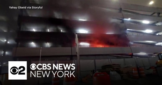Crews battle fire at JFK Airport parking garage