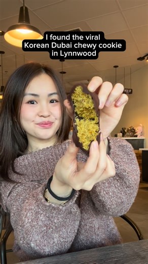 Tiffany on Instagram: "Found the viral Korean Dubai chewy cookie in Lynnwood at @rilabakeryandcafe 👀🍪 $4.50, ultra chewy, not too sweet, and SO messy (eat it fresh!). Rila Bakery understood the assignment. It honestly tasted like a rice crispy with a subtle pistachio flavor! It was definitely addicting since it wasn’t overly sweet! They also launched two other sweets and I LOVE the sticky rice cake, so crispy! The honey toast croissant was on the sweeter side but perfect for those that love ca
