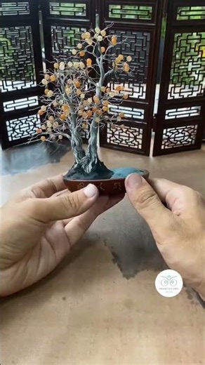 Artist is bending and twisting wire to create Bonsai tree art!