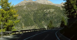 Driving in the alps, Cinema 4k pov view driving between swiss alp and mountains, on route e62, on a sunny autumn day, down from the Simplon pass, in Valais, Switzerland