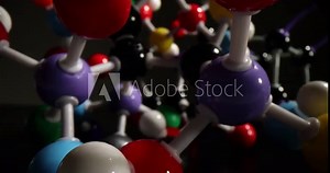 Plastic model of chemistry molecule for education on black background. Atomistic system representing processes and connections of colorful molecules