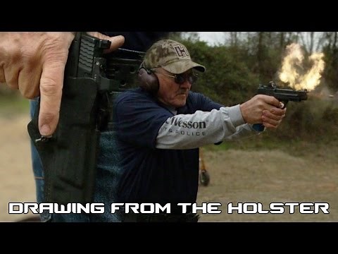 How to quickly draw out of a tactical holster with world record shooter, Jerry Miculek (60FPS)