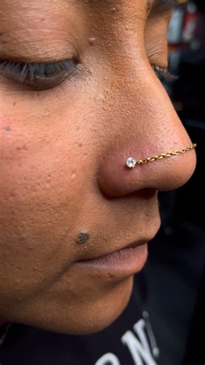 Where Precision Meets Luxury ✨ Double Nostril 24k Gold Chain Implant-grade titanium base · 24k PVD gold chain · Clear CZ Invictus Body Jewelry #doublenostrilpiercing #nostrilchain #goldnosechain #nosepiercingjewelry #bodyjewelry | GameFace Tattoo and Body Piercing LLC