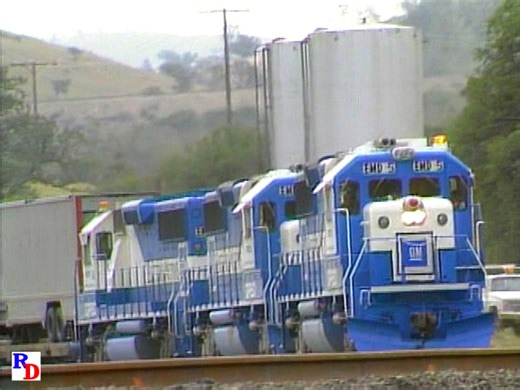 A trio of new EMD GP60 demonstrator locomotives and some Santa Fe management are heading down Tehachapi Pass at Woodford and Caliente, California. From the Pentrex show "Best of 1986 Railroading" https://rfd.video/Best1986 | Railfan Depot