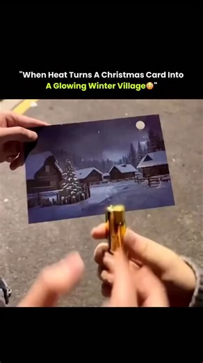 CertifiedExpert on Instagram: "At first, it looks like a simple snowy Christmas card — dark, quiet, and still. But when gentle heat is applied, the scene suddenly comes alive. Hidden windows glow, tree lights appear, and the village transforms as if electricity has been switched on. This effect is created using thermochromic ink, a special material made with leuco dyes that change structure around 30°C. When warmed, the ink turns transparent, revealing the colorful illuminated artwork printed be