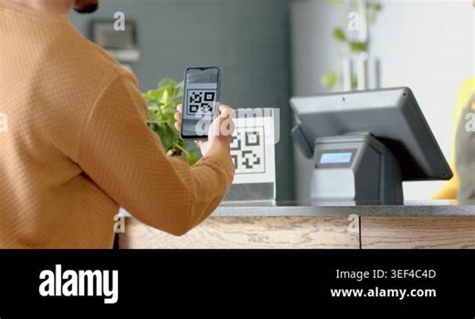 Man scanning phone and QR code sign at counter paying while female cashier confirming touchscreen. Contactless payment, retail, commerce, digital transaction, customer service, technology Stock Video Footage - Alamy