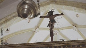 Cinematic Tracking Rack Shot Beginning Focused On Censer Then Shifts Focus To Crucifix In The Background.