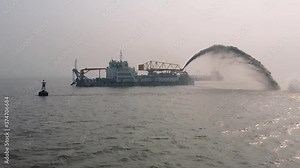 Dredging Vessel in action to keep waterways navigable, excavate and gathering sediments in the bottom and disposing at another location, close up b roll video clip