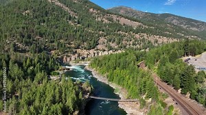Aerial View Of Kootenai Falls Suspension Bridge Spanning Across Kootenay River In Libby, Montana, USA.