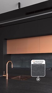 This edgy and sleek kitchen by Scopeview Projects features striking Caesarstone 5810 Black Tempal™ benchtops in the kitchen and ground floor bathroom, Rugged Concrete™ in the upstairs bathrooms and BBQ area and Airy Concrete™ in the laundry. ��The design of the sublime kitchen island bench allows for more social functionality. Whether it is being used as a breakfast bar or a place to entertain, family and guests are able to interact more fluidly, rather than sitting side by side. �Another stand-