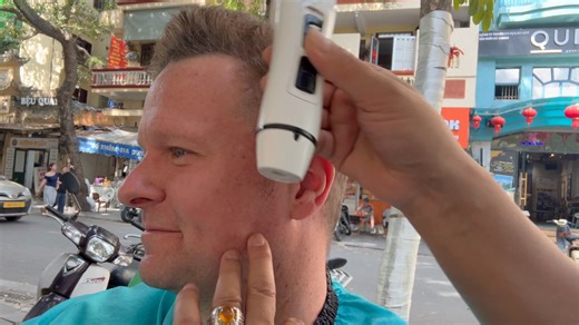 Getting a haircut on the street in Hanoi, Vietnam | Dirt Cheap with Chas Bruns | Facebook