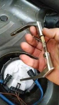 How to easily release or secure the fuel pump using a door handle