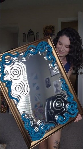 Using a layer of resin over the mirror surface, I'm able to manipulate the light reflection by hand!